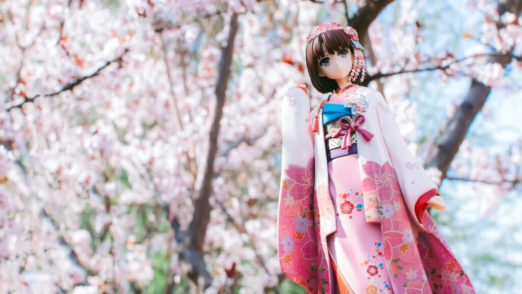 桜をバックに着物の女の子のフィギア